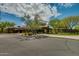 Community clubhouse with a beautiful desert landscape and walking trail in front at 32742 N 15Th Gln, Phoenix, AZ 85085