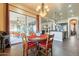 Cozy dining area with access to the outdoor patio and a view of the modern kitchen at 32742 N 15Th Gln, Phoenix, AZ 85085