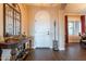 Elegant foyer features dark wood floors and a decorative arched front door at 32742 N 15Th Gln, Phoenix, AZ 85085