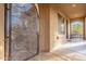 Inviting front porch with decorative security door and ample outdoor seating area at 32742 N 15Th Gln, Phoenix, AZ 85085