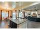 Open kitchen featuring a large island with seating and modern appliances at 32742 N 15Th Gln, Phoenix, AZ 85085
