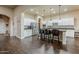 Open kitchen with stainless steel appliances, granite counters, an island with bar seating, and tile backsplash at 32742 N 15Th Gln, Phoenix, AZ 85085