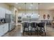 Spacious kitchen with a large island, stainless steel appliances, white cabinets, and decorative backsplash at 32742 N 15Th Gln, Phoenix, AZ 85085