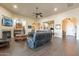 Open living room area with dark wood floors and a comfortable seating arrangement at 32742 N 15Th Gln, Phoenix, AZ 85085