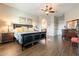 Beautiful main bedroom boasts wood floors, a ceiling fan, and elegant furnishings at 32742 N 15Th Gln, Phoenix, AZ 85085