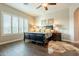Spacious main bedroom with a ceiling fan, plantation shutters, and ample natural light at 32742 N 15Th Gln, Phoenix, AZ 85085