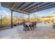 Covered patio dining next to the sparkling pool and desert landscaping at 32742 N 15Th Gln, Phoenix, AZ 85085