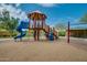 Community playground featuring a slide, climbing structure, swings, and ladder at 32742 N 15Th Gln, Phoenix, AZ 85085