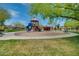 A vibrant playground with a slide and climbing structure for enjoyment in a friendly neighborhood at 32742 N 15Th Gln, Phoenix, AZ 85085