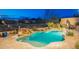 Beautiful pool with built-in waterfall feature and mountain views in the distance at 32742 N 15Th Gln, Phoenix, AZ 85085