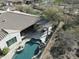 An aerial shot highlights an inviting pool and covered patio, perfect for outdoor entertaining at 32742 N 15Th Gln, Phoenix, AZ 85085