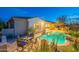 Backyard pool area featuring a covered patio, outdoor dining furniture, and desert landscaping at 32742 N 15Th Gln, Phoenix, AZ 85085
