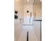 A tiled shower featuring white subway tile, a black shower head, and a black drain at 32742 N 15Th Gln, Phoenix, AZ 85085