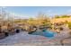 Sparkling swimming pool with rock features and desert landscaping with mountain views at 32742 N 15Th Gln, Phoenix, AZ 85085