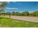 Community sand volleyball court surrounded by grass and desert landscaping at 32742 N 15Th Gln, Phoenix, AZ 85085