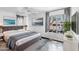 Cozy bedroom with a queen-sized bed, ceiling fan, and a picture window with natural light at 3500 N Hayden Rd # 2201, Scottsdale, AZ 85251