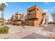 Exterior view of modern apartment complex with trees and brick walkway at 3500 N Hayden Rd # 2201, Scottsdale, AZ 85251