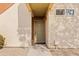 Front door to unit 2201 with neutral paint and stone landscaping at 3500 N Hayden Rd # 2201, Scottsdale, AZ 85251