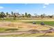 Picturesque view of a golf course with fairways, trees, and mountain views against a clear blue sky at 3500 N Hayden Rd # 2201, Scottsdale, AZ 85251