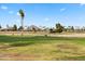 Scenic golf course view with lush green grass, tall palm trees, and picturesque mountain backdrop on a sunny day at 3500 N Hayden Rd # 2201, Scottsdale, AZ 85251