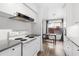 Compact kitchen with modern appliances, ample counter space, and a cozy dining area with a view at 3500 N Hayden Rd # 2201, Scottsdale, AZ 85251