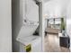 Convenient in-unit laundry room with stacked washer and dryer; maximizing space with view to living room at 3500 N Hayden Rd # 2201, Scottsdale, AZ 85251