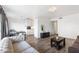 Open-concept living area features sleek wood flooring, neutral decor, and a modern, minimalist aesthetic at 3500 N Hayden Rd # 2201, Scottsdale, AZ 85251