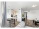 Spacious living room with wood flooring, seamlessly connecting the kitchen and dining area, perfect for entertaining at 3500 N Hayden Rd # 2201, Scottsdale, AZ 85251