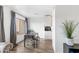 Bright living area with wood floors connects to the kitchen, offering open-concept living with great natural light at 3500 N Hayden Rd # 2201, Scottsdale, AZ 85251