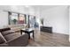 Bright living room with wood floors, neutral walls, and comfortable sofas by window with natural light at 3500 N Hayden Rd # 2201, Scottsdale, AZ 85251