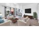 Bright living room with hardwood floors, modern furniture, and large windows offering natural light at 3500 N Hayden Rd # 2201, Scottsdale, AZ 85251