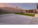 This beautiful backyard features a tennis court, pergola, outdoor kitchen, hot tub, and green space at 3840 W Brogan Ct, New River, AZ 85087