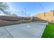 This backyard has a tennis court setup on a smooth concrete surface at 3840 W Brogan Ct, New River, AZ 85087