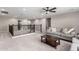 Spacious loft area with a cozy couch, dark wood railing, and ample natural light at 3840 W Brogan Ct, New River, AZ 85087
