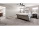 Comfortable primary bedroom featuring a plush bed, soft lighting, and relaxing ambiance at 3840 W Brogan Ct, New River, AZ 85087