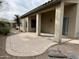 Covered patio features decorative concrete, pillars, lush landscaping, and desert plants at 40915 N Columbia Trl, Anthem, AZ 85086