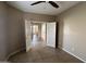Comfortable bedroom with neutral colors, tile floors, and ceiling fan at 40915 N Columbia Trl, Anthem, AZ 85086