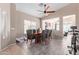 Formal dining room with a large window, ceiling fan, and tile flooring at 40915 N Columbia Trl, Anthem, AZ 85086