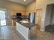 Charming kitchen with stainless steel appliances and center island at 40915 N Columbia Trl, Anthem, AZ 85086