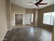 Spacious living room featuring wood-look floors, neutral walls, and ample natural light at 40915 N Columbia Trl, Anthem, AZ 85086