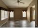 Elegant living room with wood-look flooring, neutral paint, and plenty of light at 40915 N Columbia Trl, Anthem, AZ 85086
