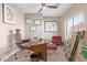 Home office with a large desk, modern furniture, and a ceiling fan at 40915 N Columbia Trl, Anthem, AZ 85086