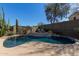 Backyard pool featuring mature landscaping, a raised sundeck and cacti at 40915 N Columbia Trl, Anthem, AZ 85086