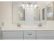 Bathroom features a double sink vanity with new light fixtures and hardware at 4346 E Corral St, Phoenix, AZ 85044
