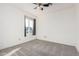 Carpeted bedroom featuring a ceiling fan and window at 4346 E Corral St, Phoenix, AZ 85044