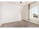 Bedroom with neutral carpeting, ceiling fan, and window letting in natural light at 4346 E Corral St, Phoenix, AZ 85044