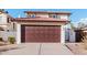 Home exterior showcasing a two-car garage and driveway at 4346 E Corral St, Phoenix, AZ 85044