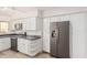 Bright kitchen features white cabinets, stainless steel appliances, and modern countertops at 4346 E Corral St, Phoenix, AZ 85044