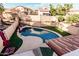Aerial view of a backyard pool, patio, and desert landscaping at 4346 E Corral St, Phoenix, AZ 85044
