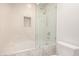 Clean bathroom with a glass-enclosed shower over tub with a tiled backsplash at 4525 N 66Th E St # 55, Scottsdale, AZ 85251